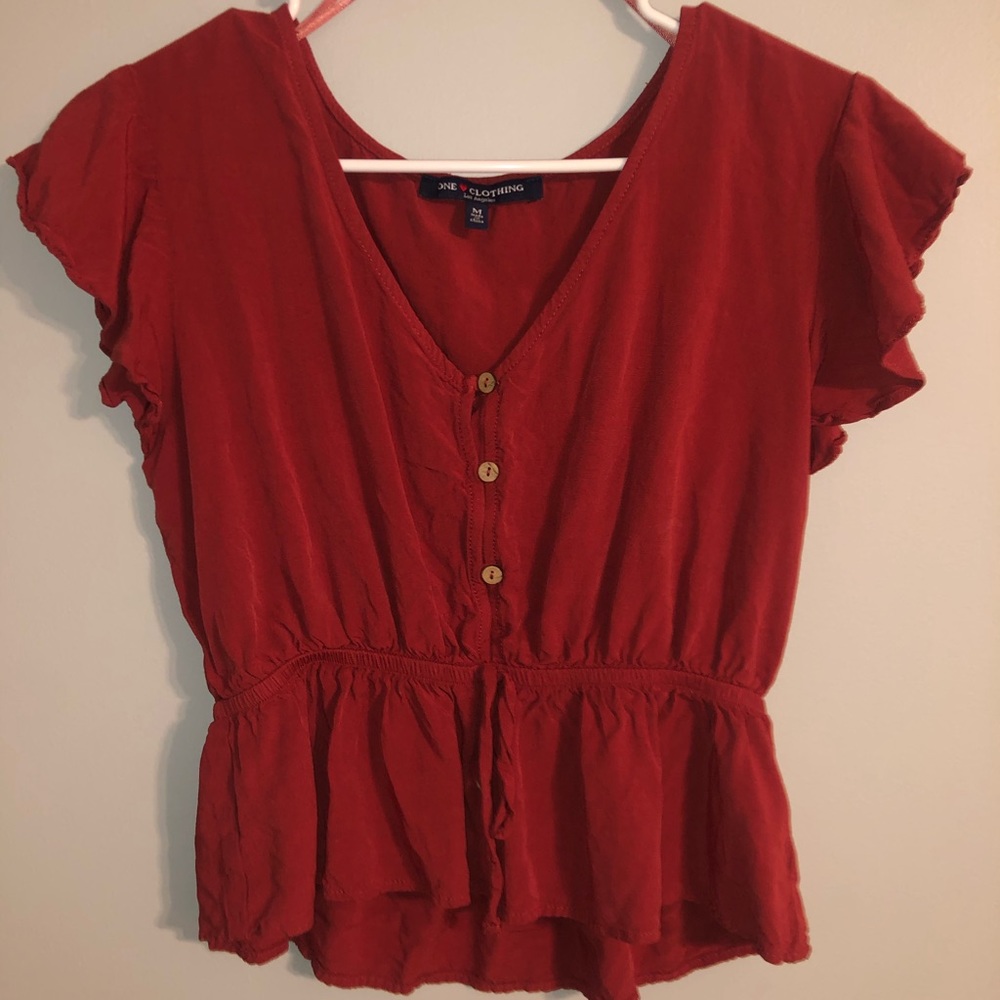 Trendy waist clenched top